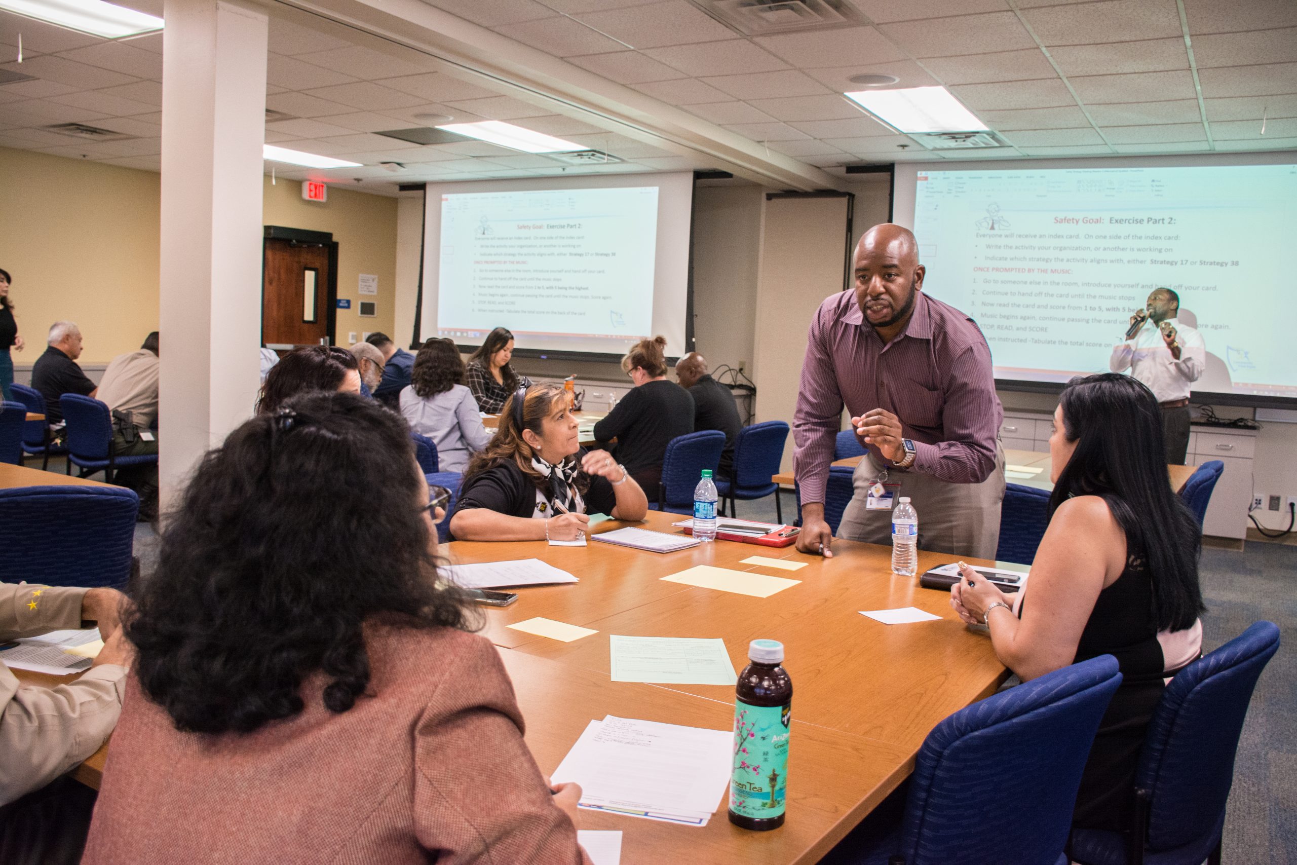 Tab Okonkwo instructing a classroom.